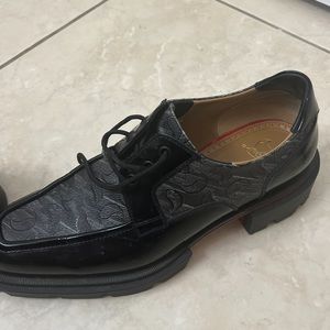 Christian Louboutin.   Only worn few times